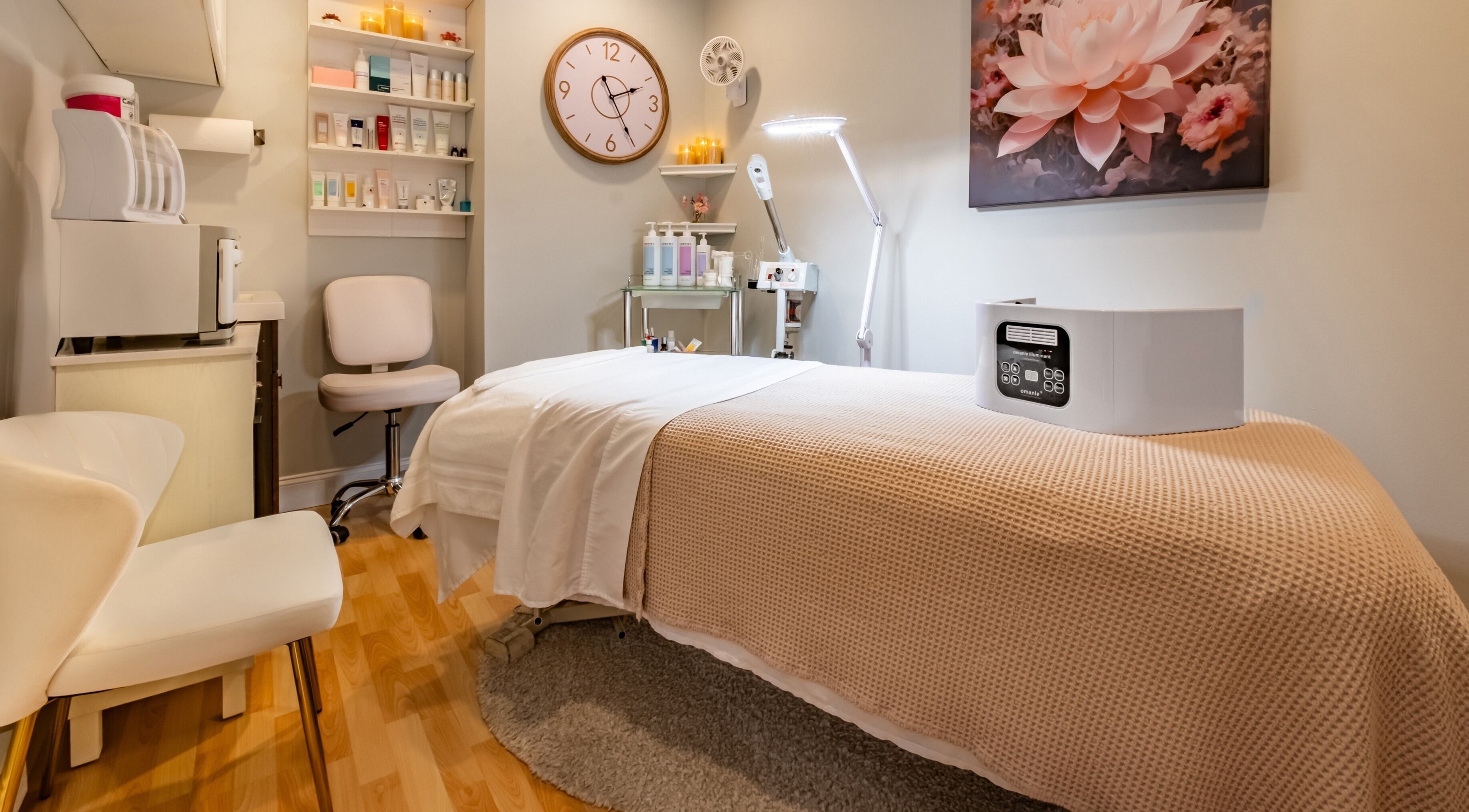 Tranquil Pink Glow Facial Room with serene decor and cozy bed in Manasquan, New Jersey, US.