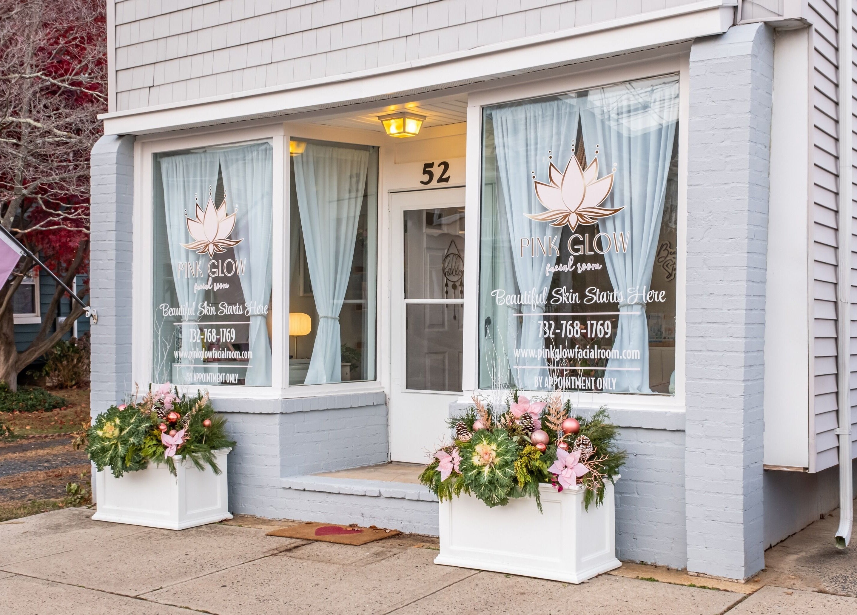 Charming exterior of Pink Glow Facial Room in Manasquan, New Jersey, US featuring elegant signage and decor.