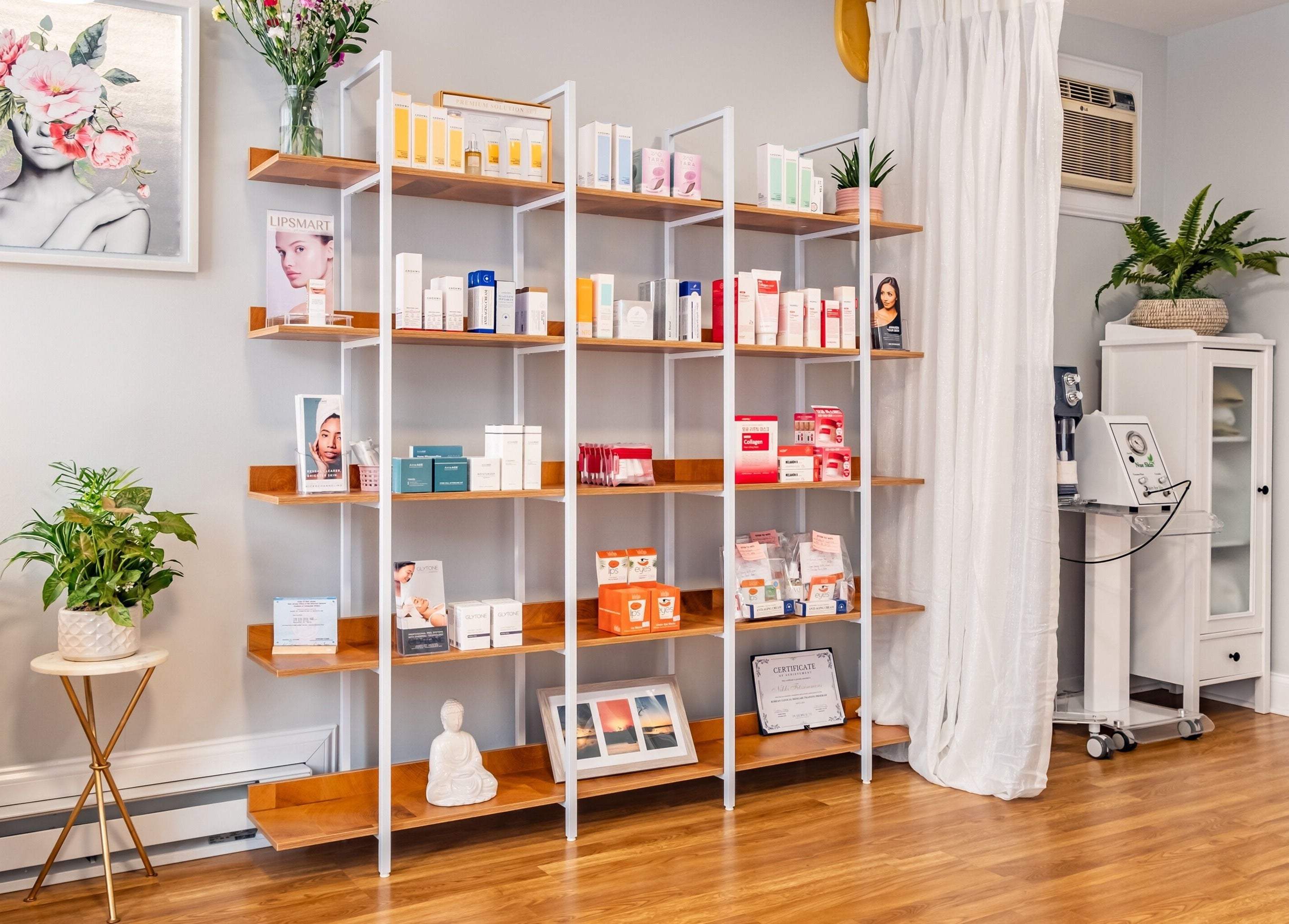 Product display and tranquil decor in Pink Glow Facial Room, Manasquan, New Jersey, US.