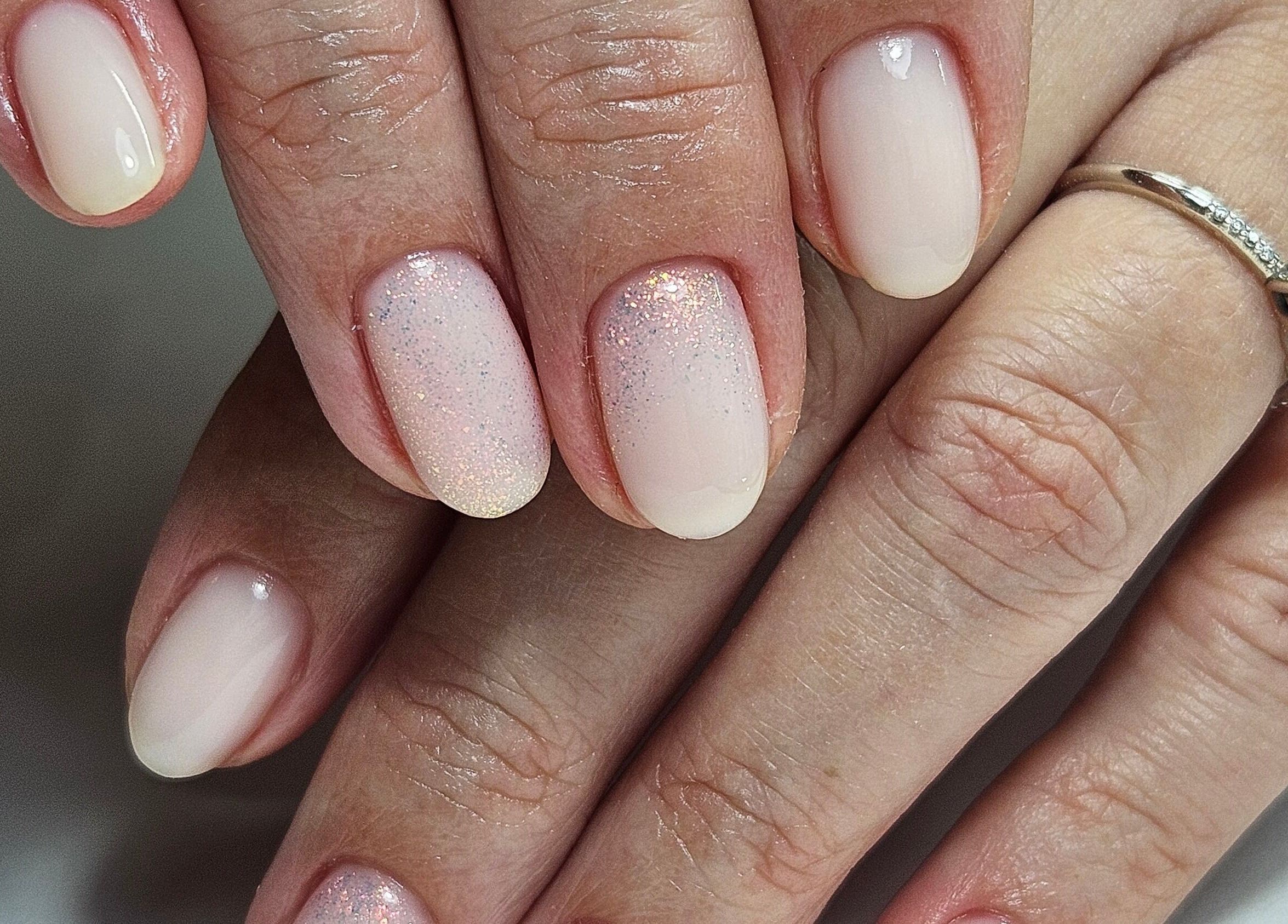 Close-up of glittery manicure at Lauren Anne Nails, Auckland, Auckland, NZ showcasing a soft, elegant design.