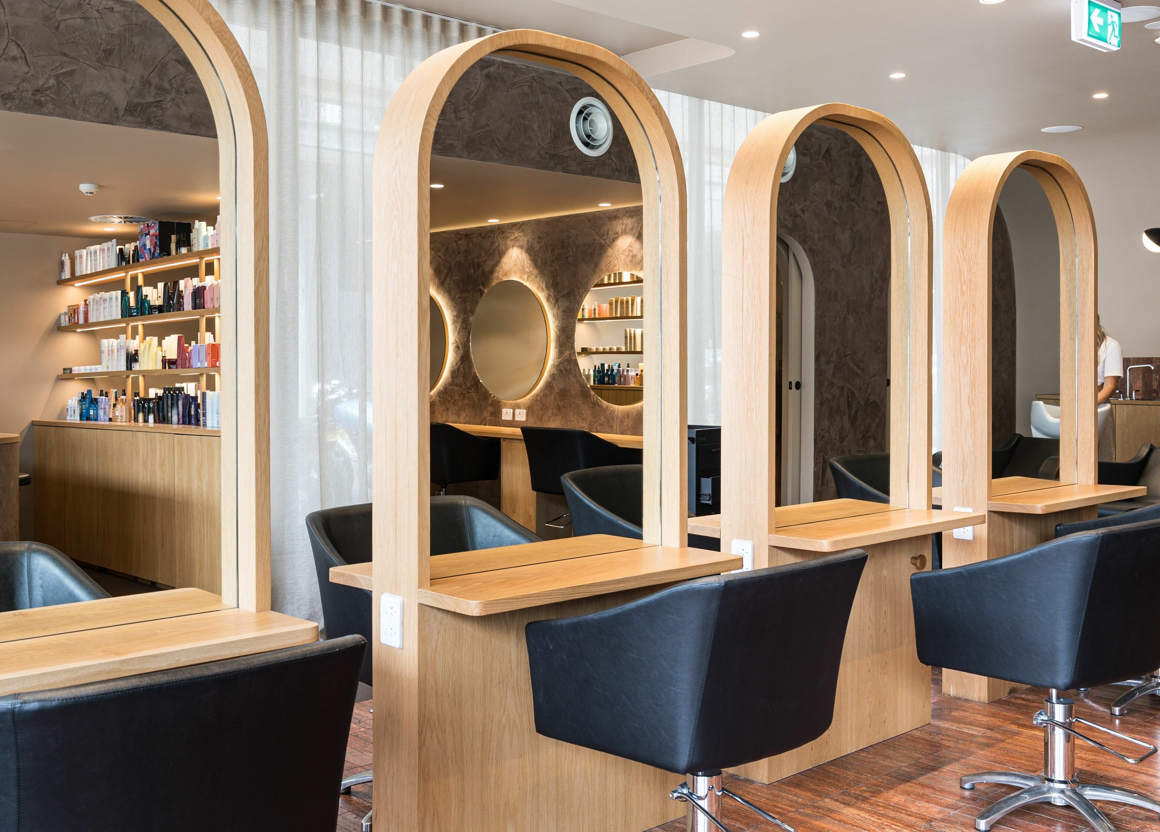 Luxurious interior of Mokosh Studio at Bondi Beach, New South Wales, AU featuring stylish salon archways.