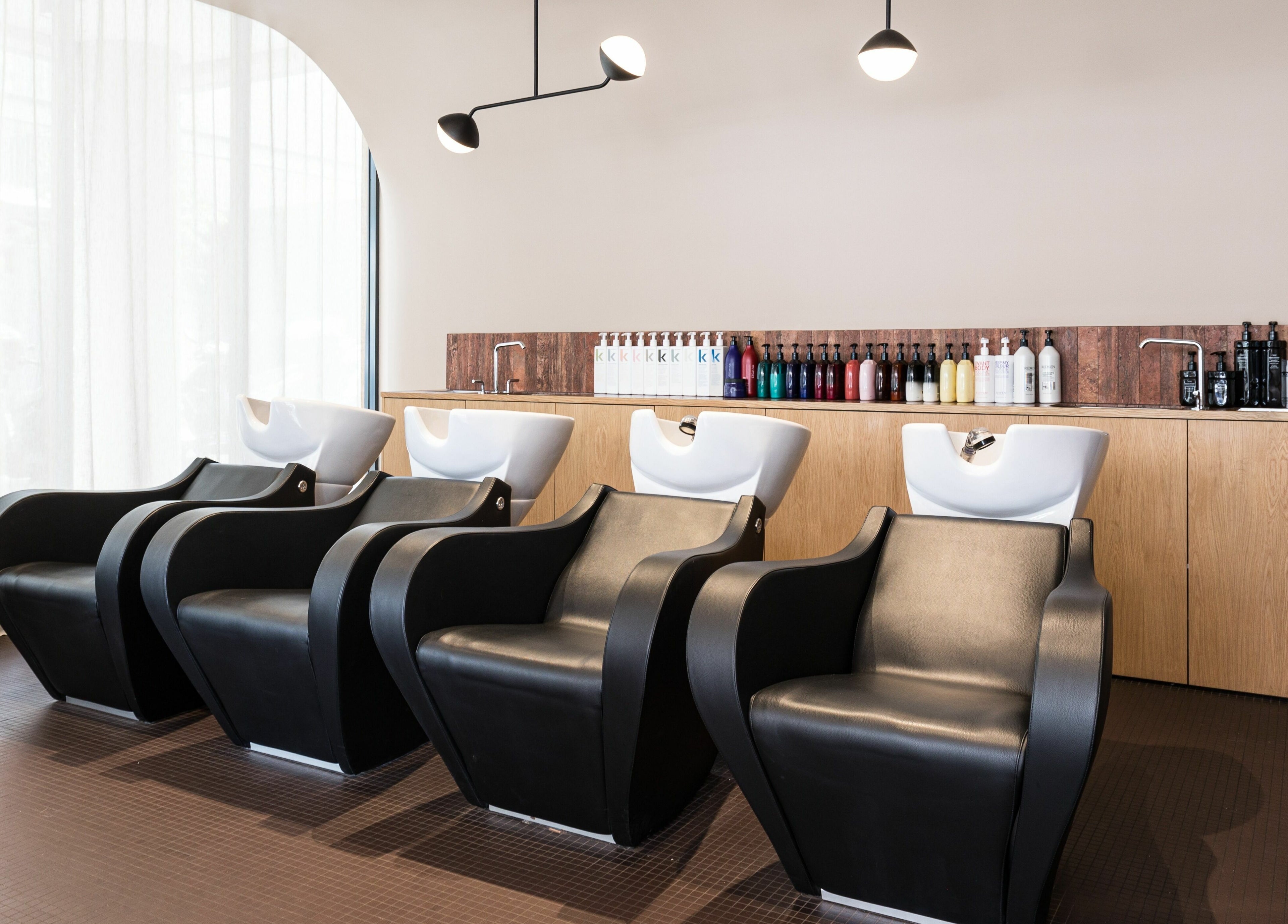 Luxurious hair washing stations at Mokosh Studio, Bondi Beach, New South Wales, AU, creating a relaxing ambiance.