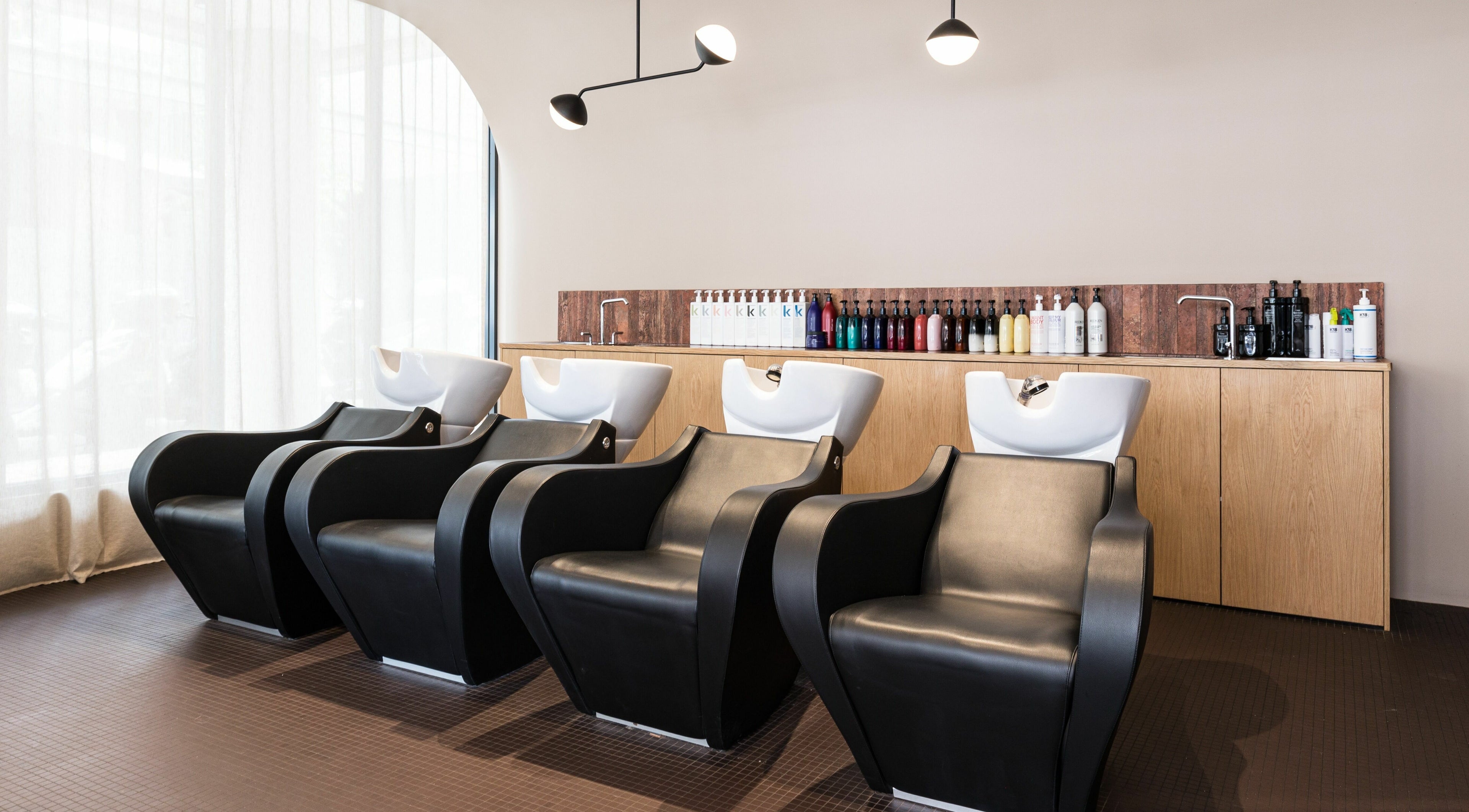 Luxurious hair washing stations at Mokosh Studio, Bondi Beach, New South Wales, AU, creating a relaxing ambiance.