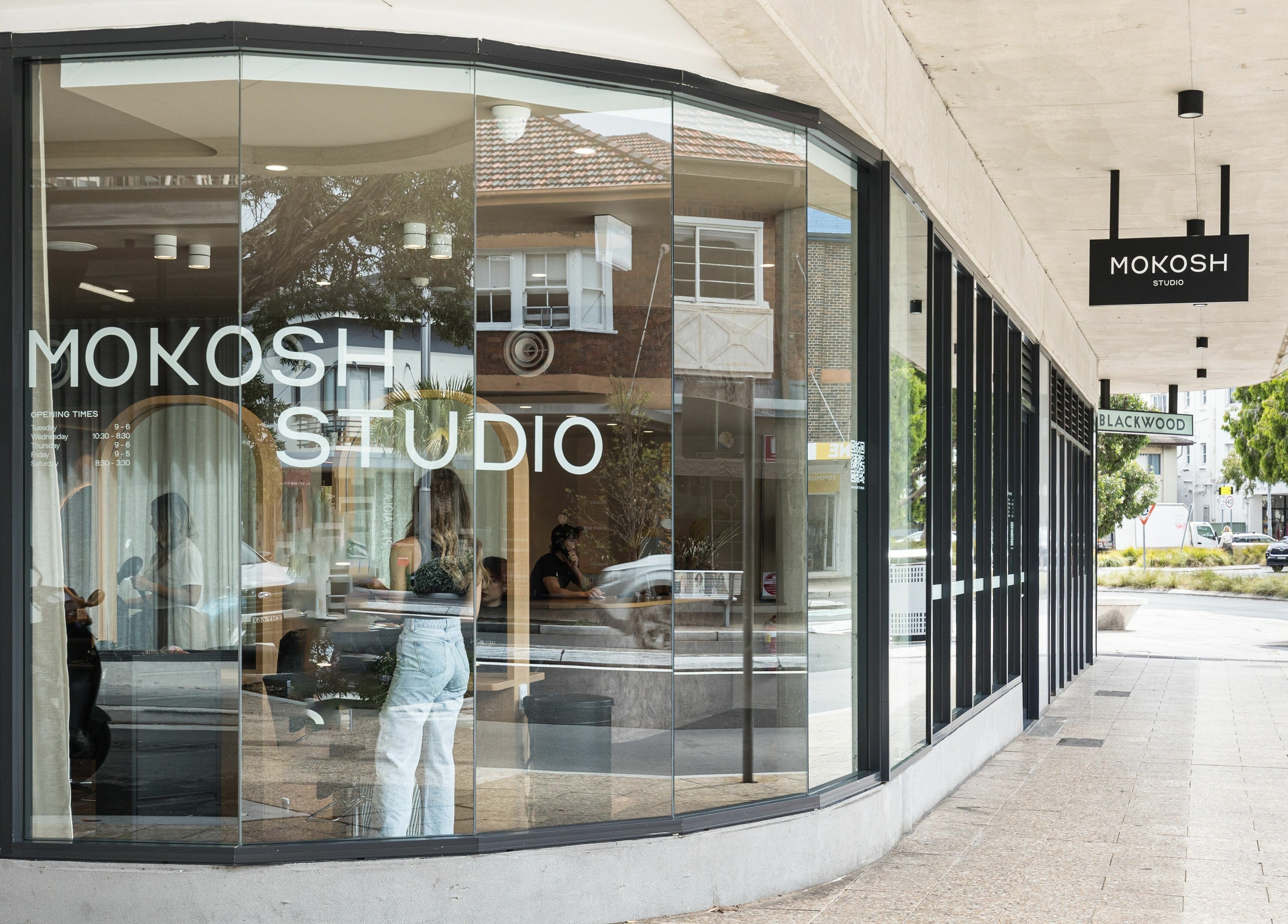 Exterior view of Mokosh Studio at Bondi Beach, New South Wales, AU showcasing modern glass design.