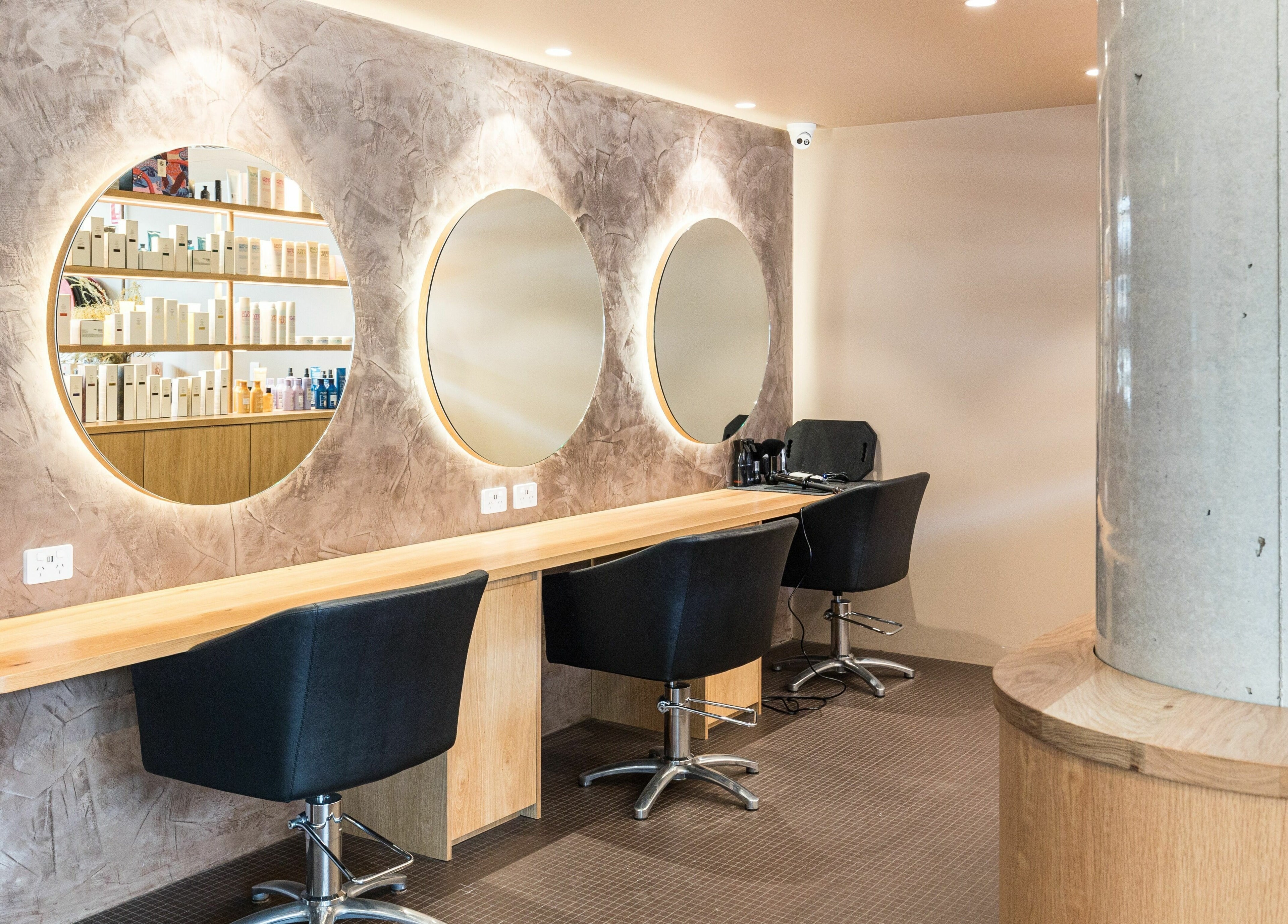 Elegant hairstyling stations with mirrors at Mokosh Studio, Bondi Beach, New South Wales, AU.