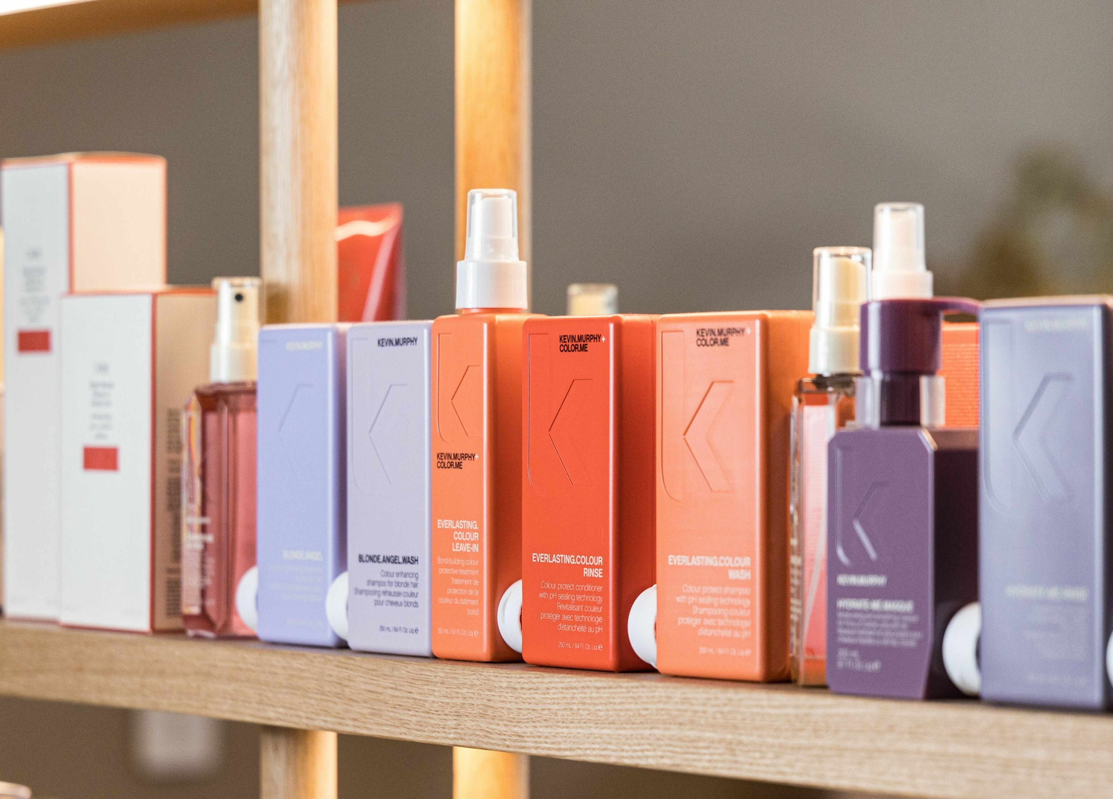 Colorful hair care products on a shelf at Mokosh Studio, Bondi Beach, New South Wales, AU.