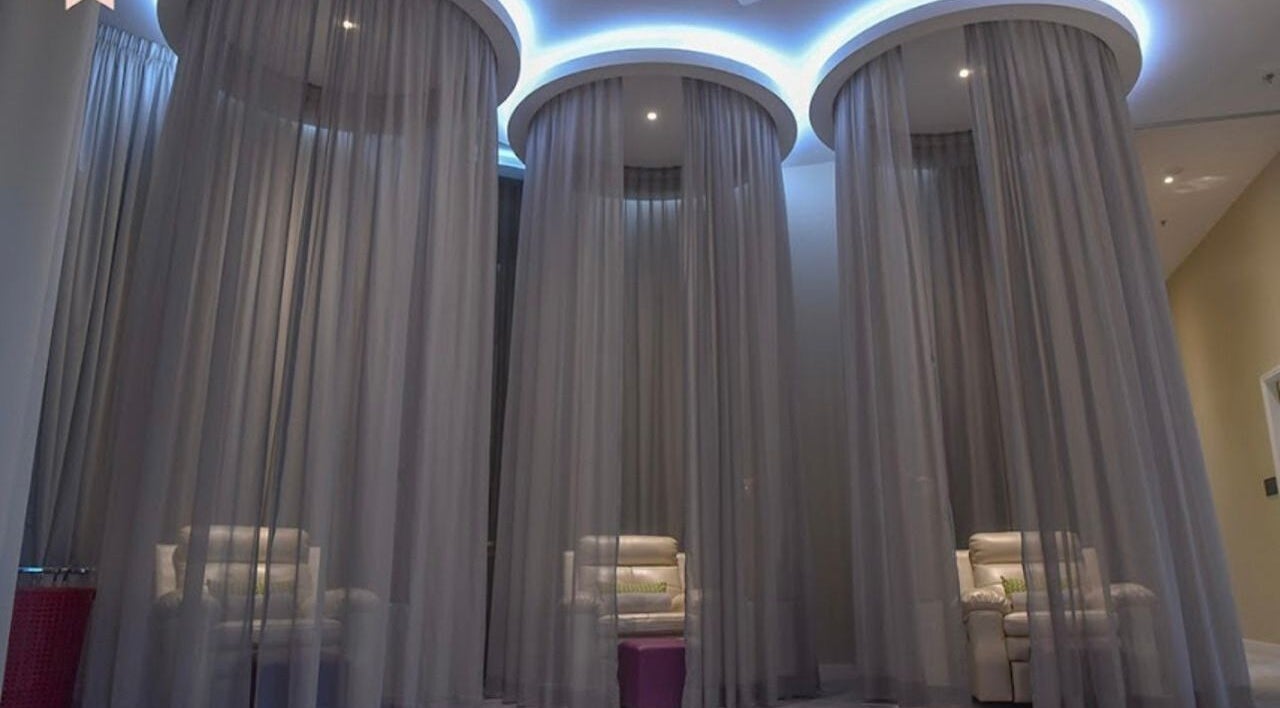 Relaxing spa chairs surrounded by elegant curtains at Tower Spa Penang, George Town, Pulau Pinang, MY.