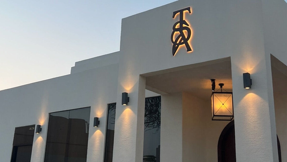 Elegant facade of The Space Beauty Lounge in أبوظبي, Abu Dhabi, AE illuminated at dusk.