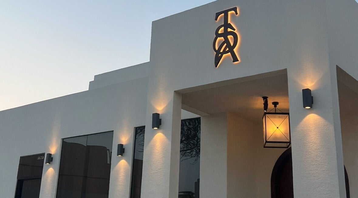 Elegant facade of The Space Beauty Lounge in أبوظبي, Abu Dhabi, AE illuminated at dusk.