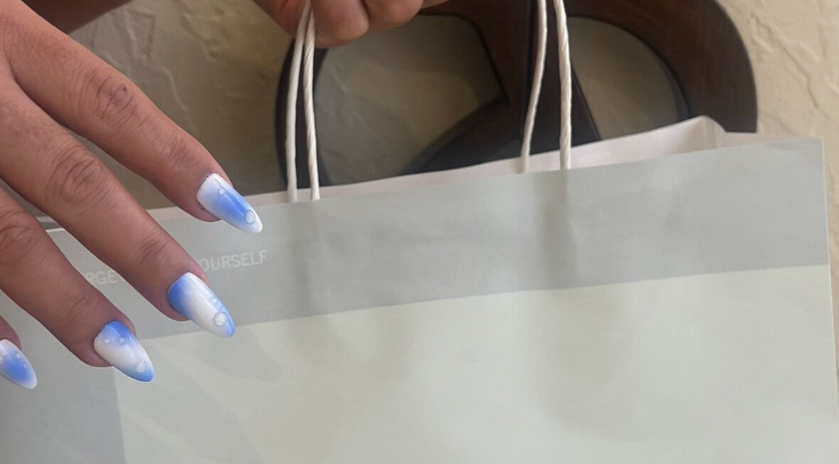 Elegant blue and white nails at The Space Beauty Lounge, أبوظبي, Abu Dhabi, AE, paired with a stylish bag.