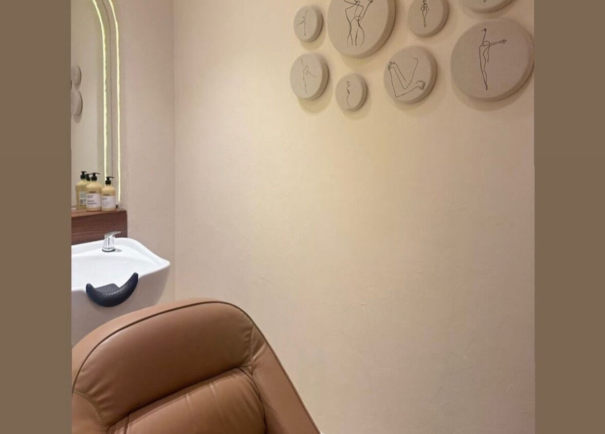 Elegant treatment room at The Space Beauty Lounge, Abu Dhabi, AE, featuring modern decor and soothing ambiance.