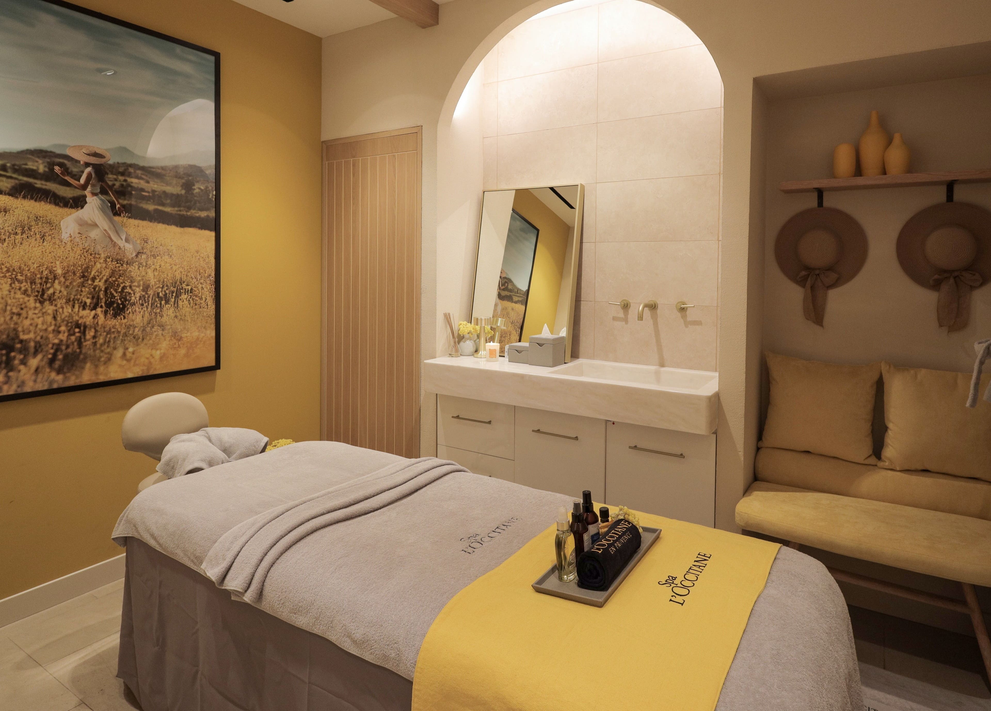 Tranquil treatment room at L’Occitane Spa at Dubai Hills, دبي, دبي, AE with soothing decor and massage bed.
