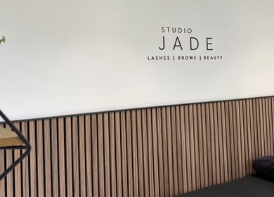 Interior view of Jade Lashes Brows Beauty Studio, Baston, England with sleek wooden decor and modern design.
