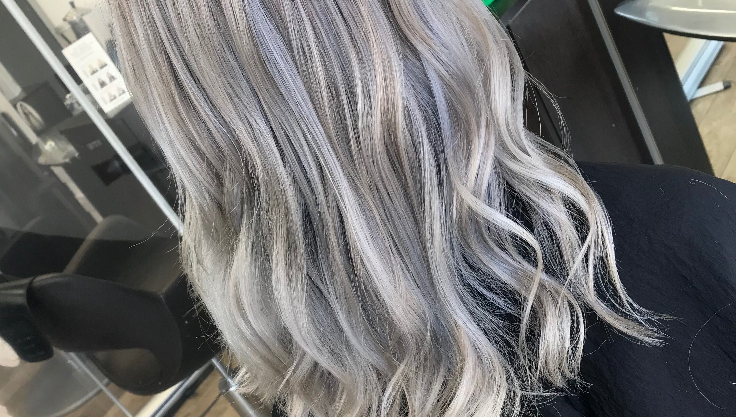 Elegant silver-blonde hair styled at Jade Gunnett Hairdressing in Blunsdon Saint Andrew, England, GB.