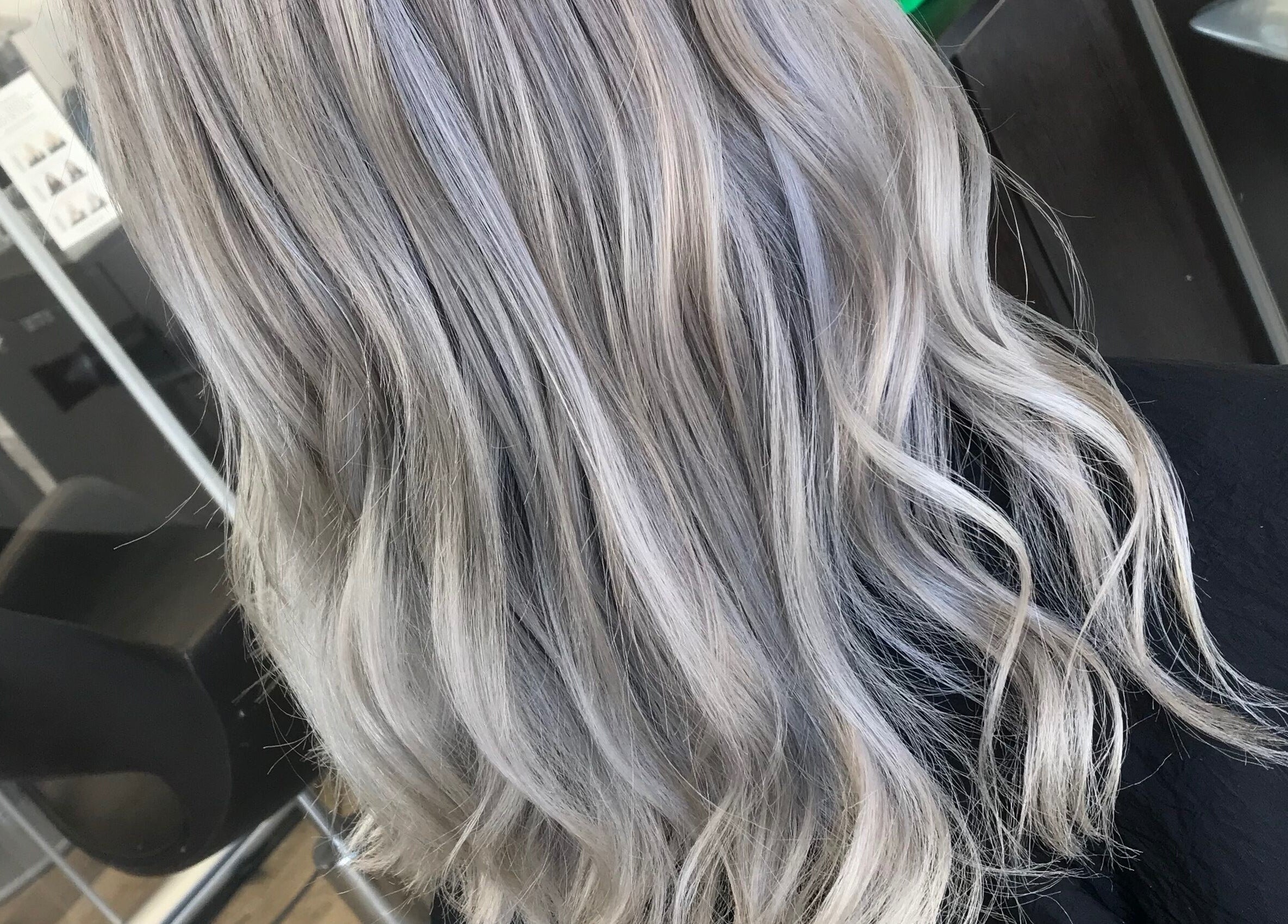 Elegant silver-blonde hair styled at Jade Gunnett Hairdressing in Blunsdon Saint Andrew, England, GB.