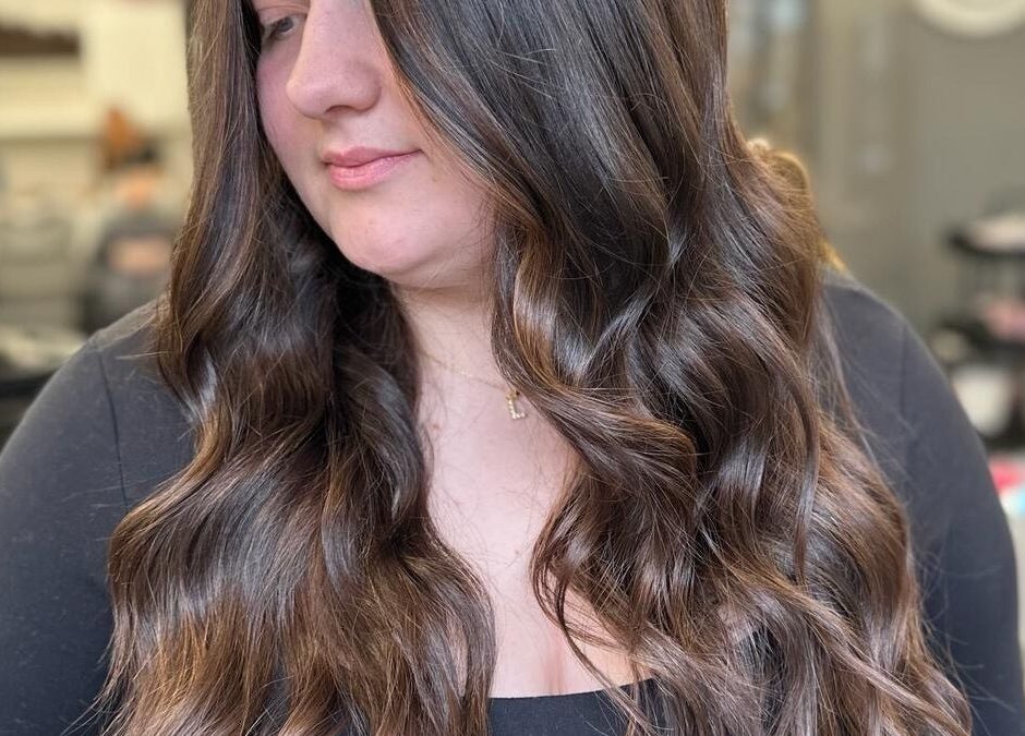 Elegant long, wavy hairstyle at Jade Gunnett Hairdressing in Blunsdon Saint Andrew, England, GB.