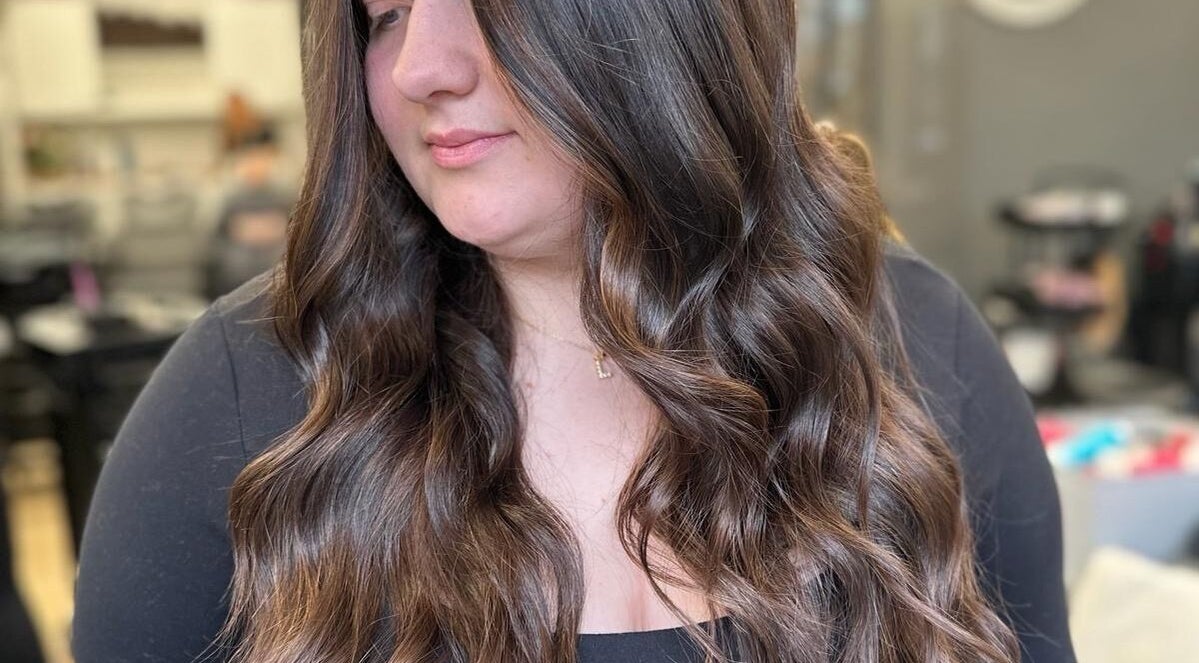 Elegant long, wavy hairstyle at Jade Gunnett Hairdressing in Blunsdon Saint Andrew, England, GB.
