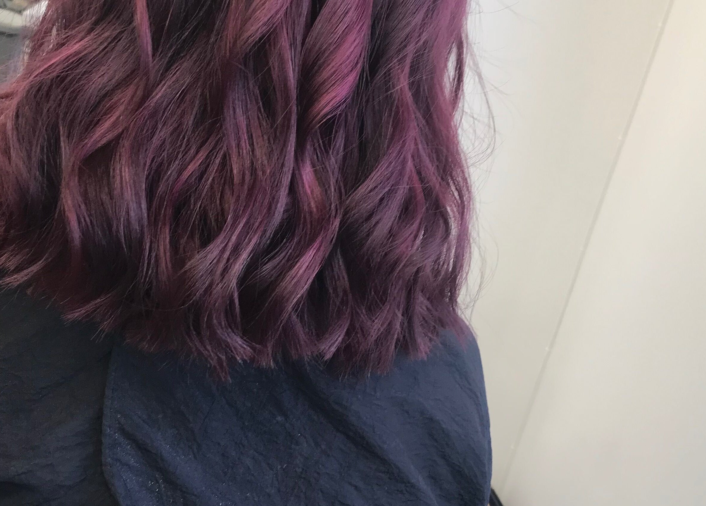Vibrant purple hair waves styled at Jade Gunnett Hairdressing, Blunsdon Saint Andrew, England, GB.