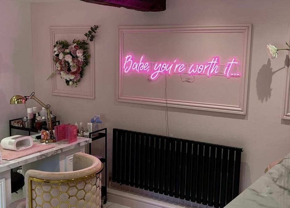 Chic interior of Fancy Academy Limited in Swinton, England, GB featuring elegant decor and beauty products.