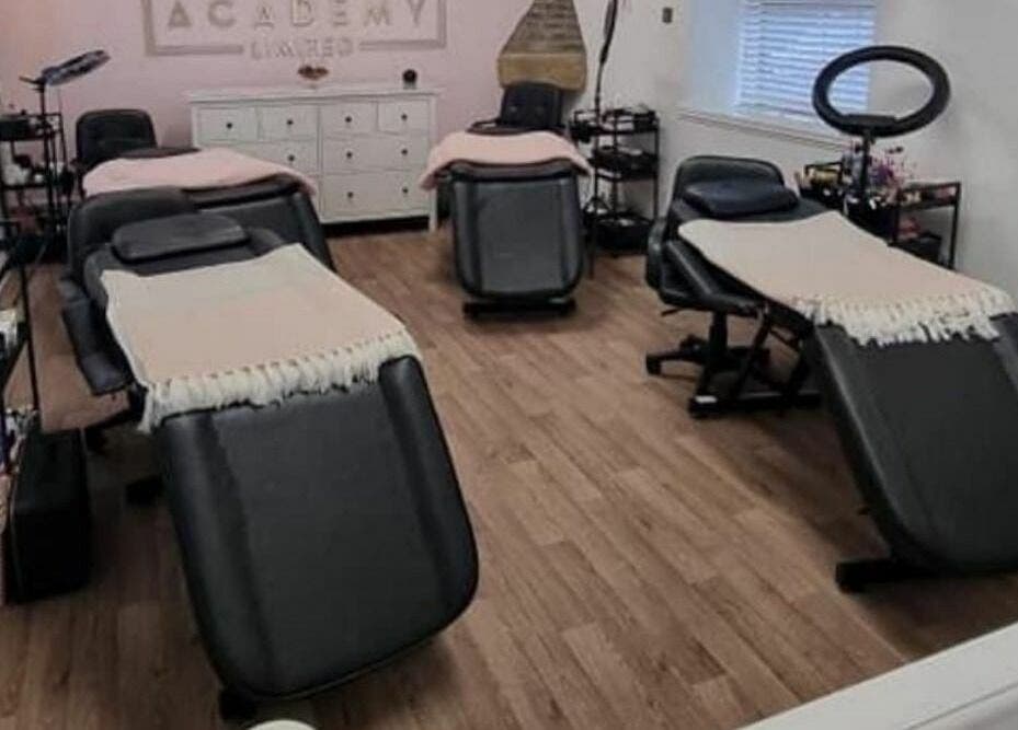 Elegant treatment room at Fancy Academy Limited, Swinton, England, GB, featuring sleek massage tables.