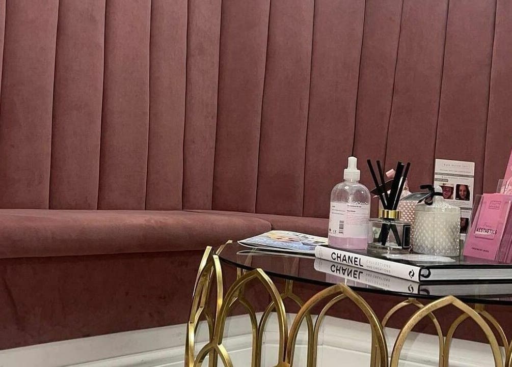 Elegant lounge at Fancy Academy Limited, Swinton, England, GB featuring a plush seating and decorative table.