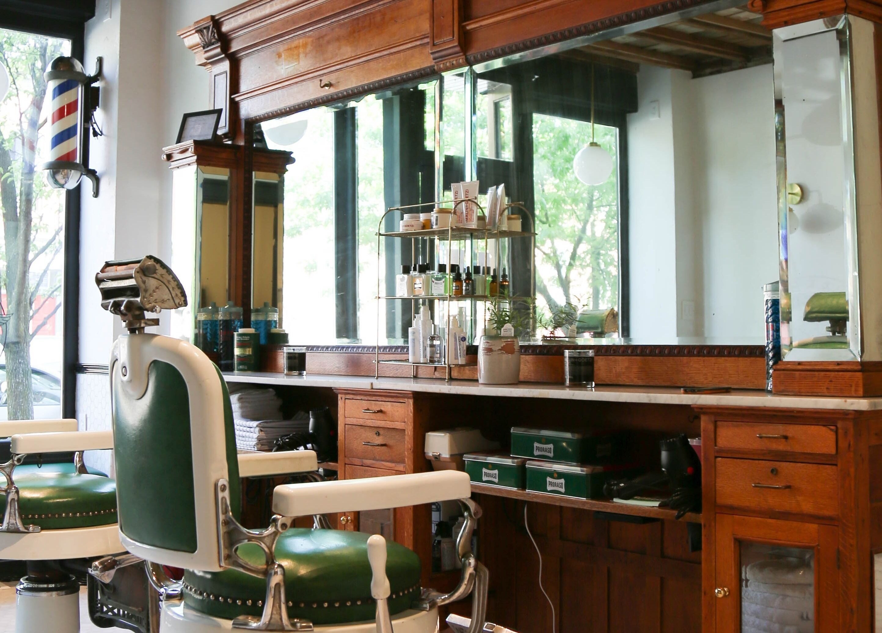 Classic barber chairs and wooden counter at Bar•Ber, Cold Spring, New York, US.