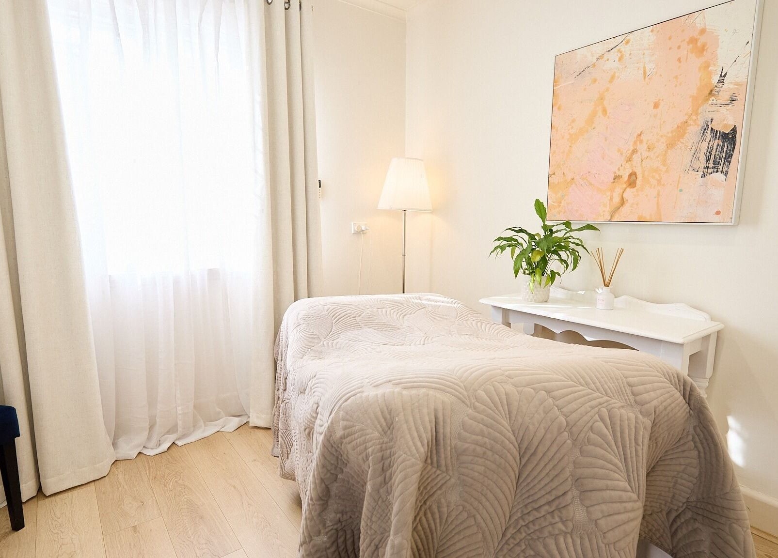 Cozy treatment room at The Skin Code By Bronzalicious, North Sydney, New South Wales, AU with modern decor.