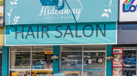 Exterior view of Hideaway Hair salon at Moffat Beach, Queensland, AU showcasing its inviting entrance.