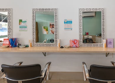 Sophisticated interior of Hideaway Hair with three ornate mirrors in Moffat Beach, Queensland, AU.