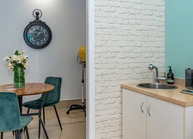 Chic seating area and sink at Hideaway Hair, Moffat Beach, Queensland, AU. Perfect salon ambiance.