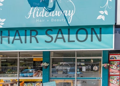 Front view of Hideaway Hair at Moffat Beach, Queensland, AU featuring a stylish salon entrance.