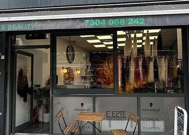 Street view of E'este Hair & Beauty salon in London, England, GB with stylish window displays.