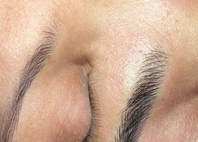Close-up of well-groomed eyebrows at E'este Hair & Beauty, London, England, GB.