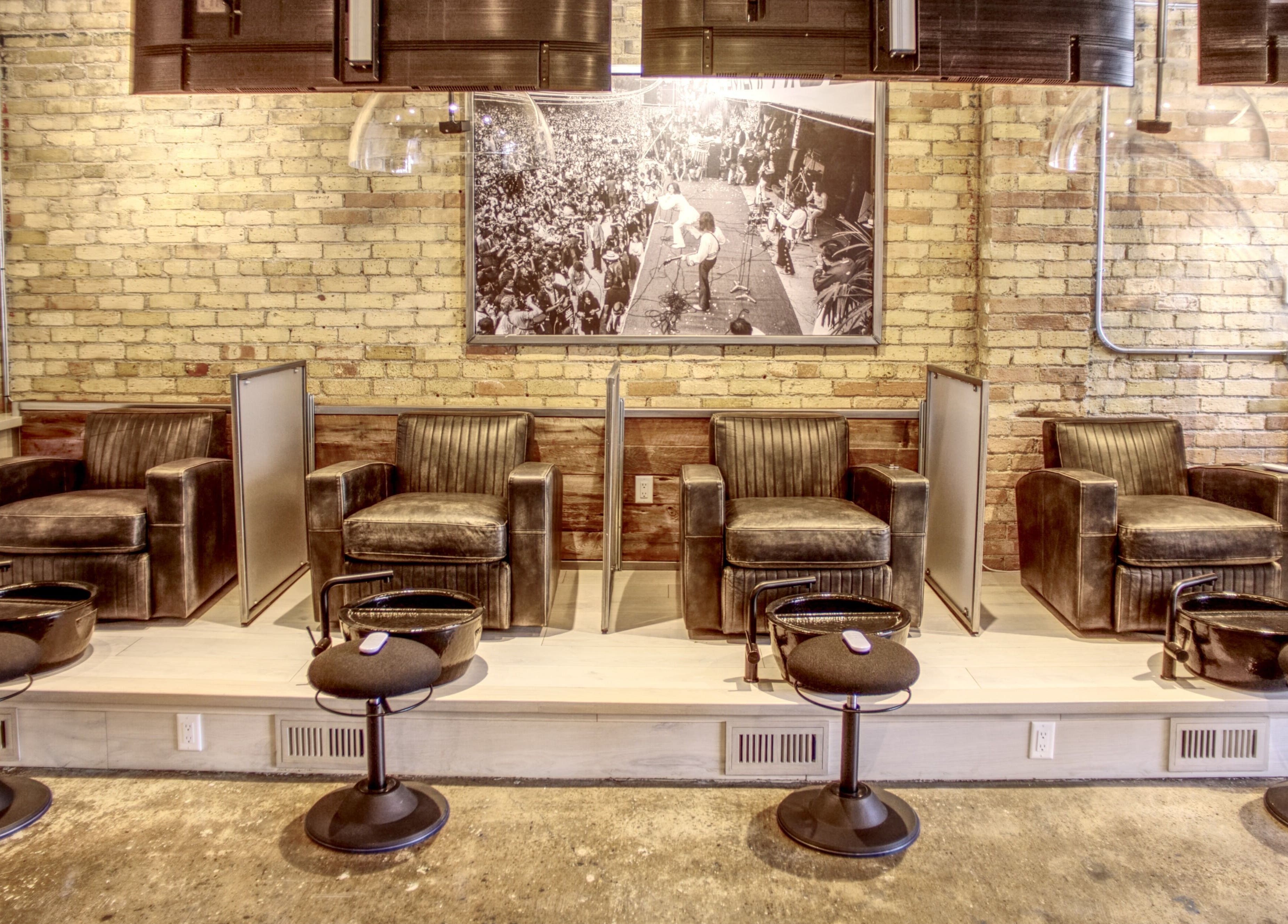 Luxurious seating at Menicure Queen West, Toronto, Ontario, CA, showcasing modern beauty and wellness ambiance.