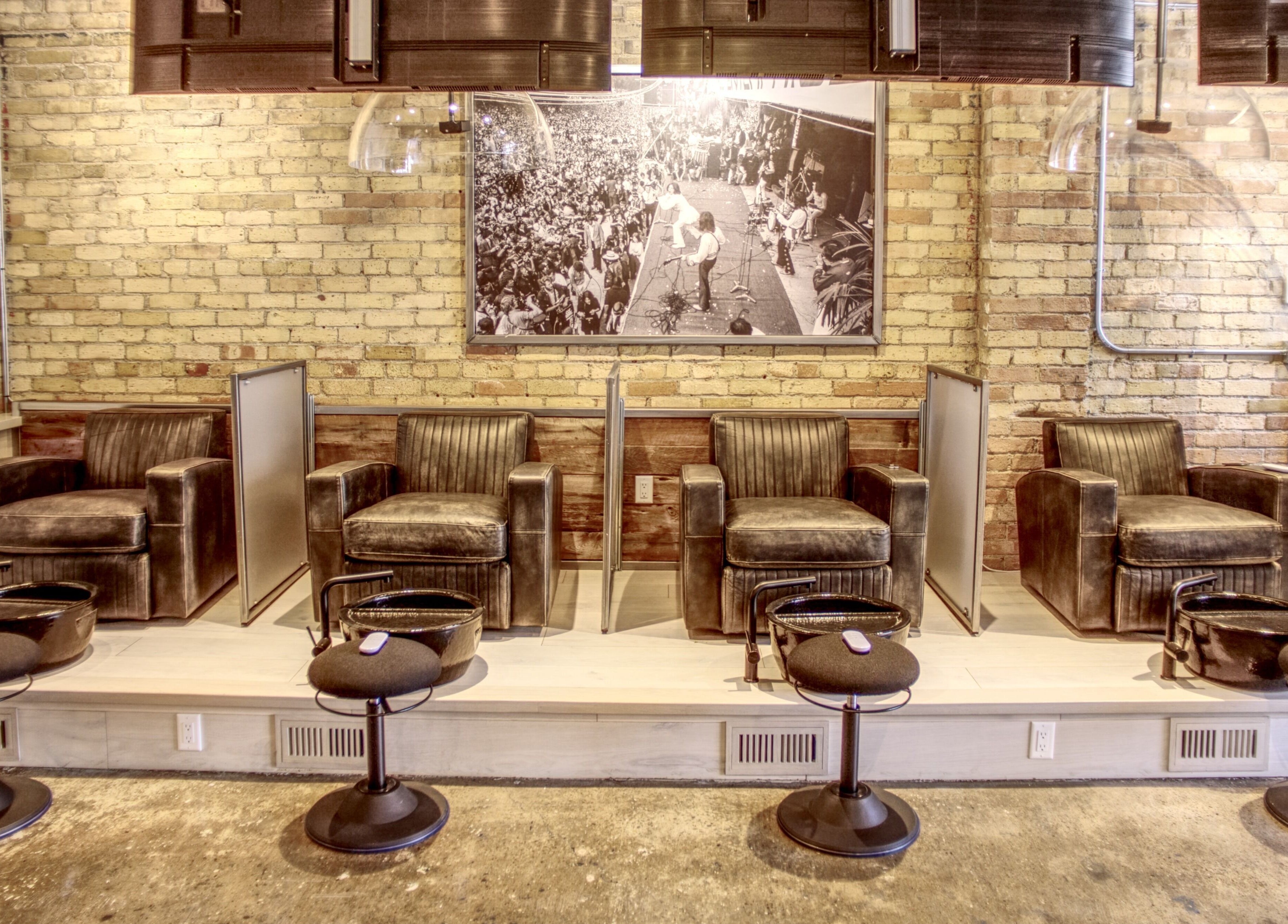 Luxurious seating at Menicure Queen West, Toronto, Ontario, CA, showcasing modern beauty and wellness ambiance.
