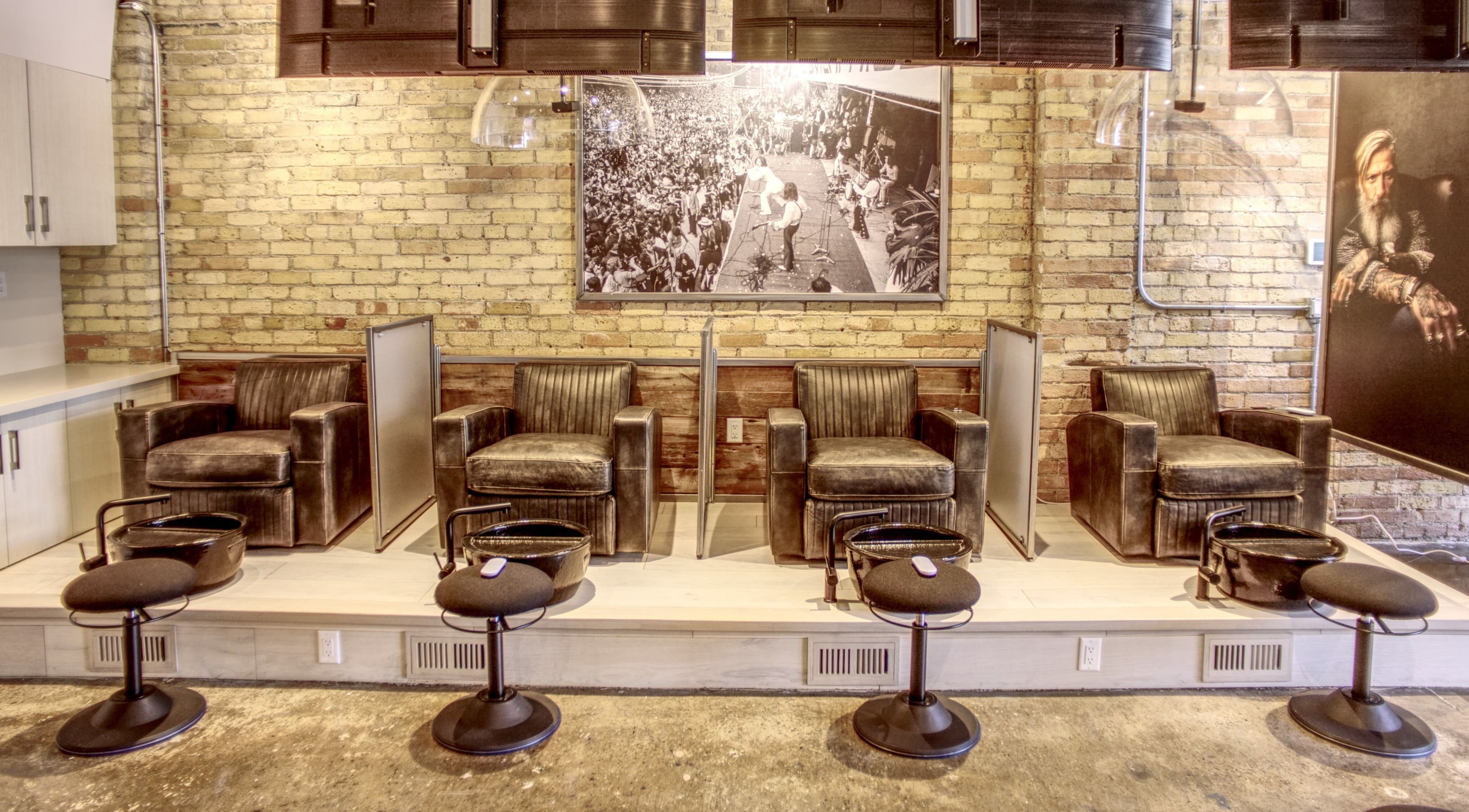 Luxurious seating at Menicure Queen West, Toronto, Ontario, CA, showcasing modern beauty and wellness ambiance.