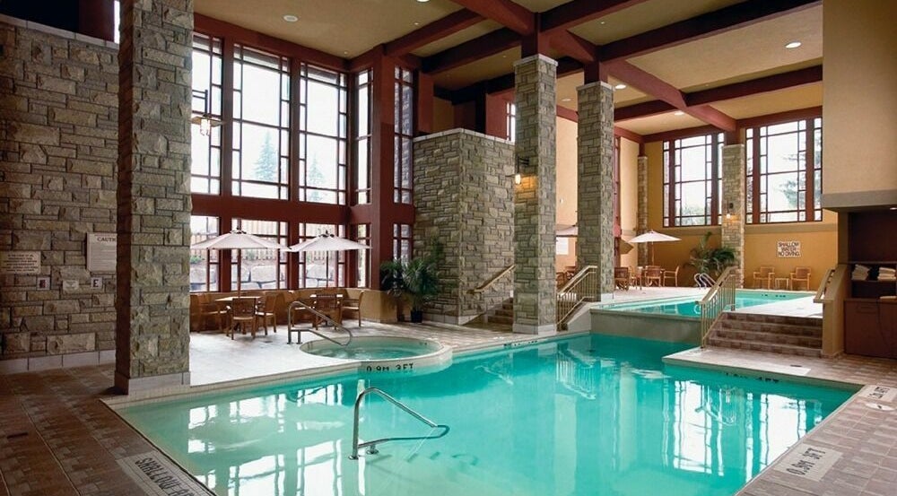 Relaxing indoor pool at Five Lakes Spa Aveda, Niagara Falls, Ontario, CA, offering a tranquil retreat.