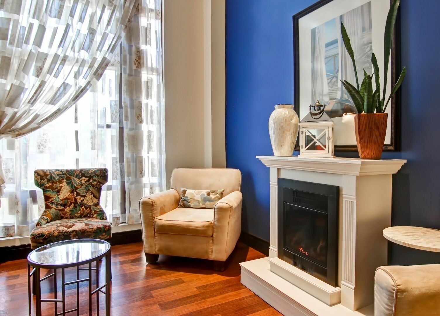 Elegant seating area at Five Lakes Spa Aveda in Niagara Falls, Ontario, CA, featuring stylish decor and comfort.