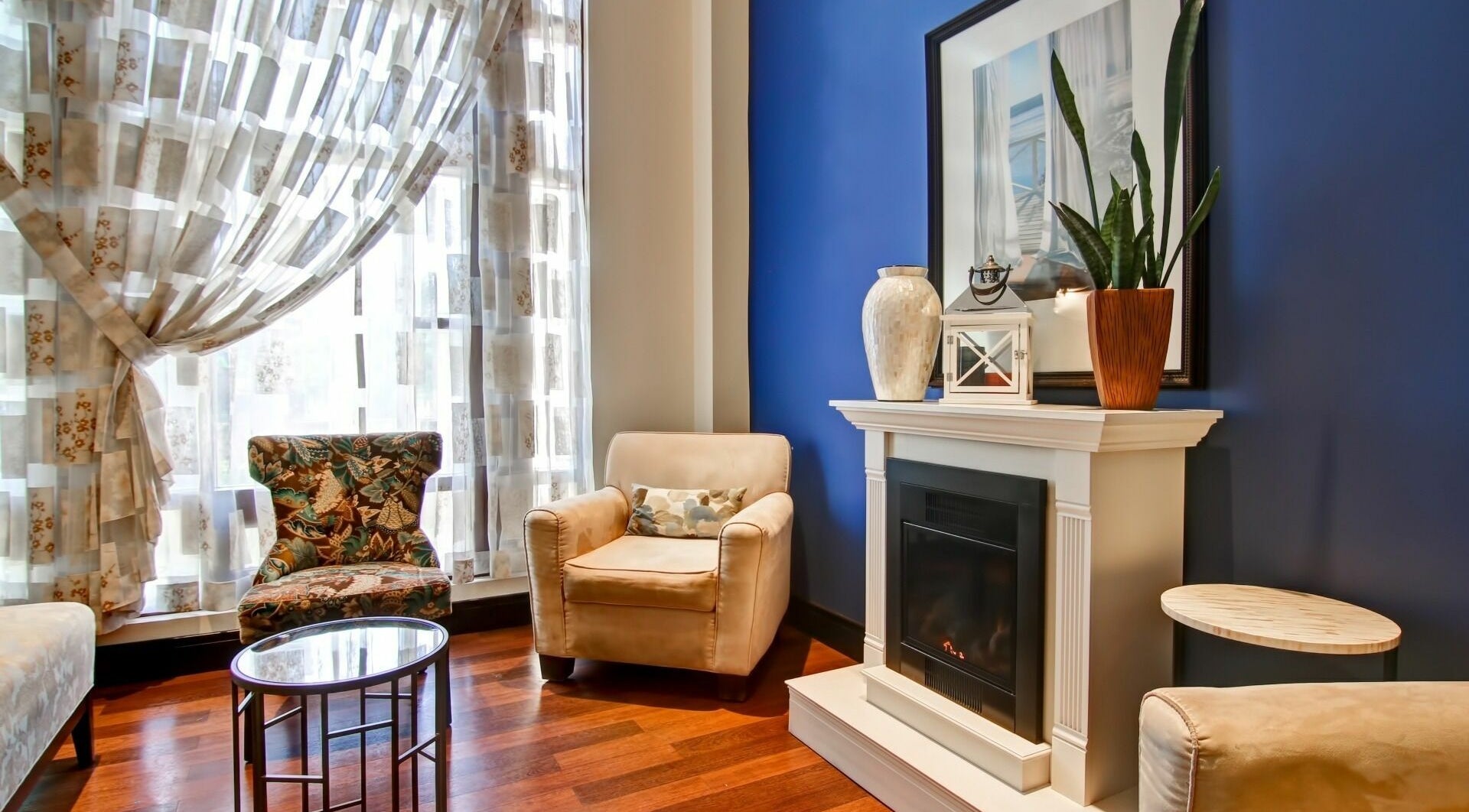 Elegant seating area at Five Lakes Spa Aveda in Niagara Falls, Ontario, CA, featuring stylish decor and comfort.