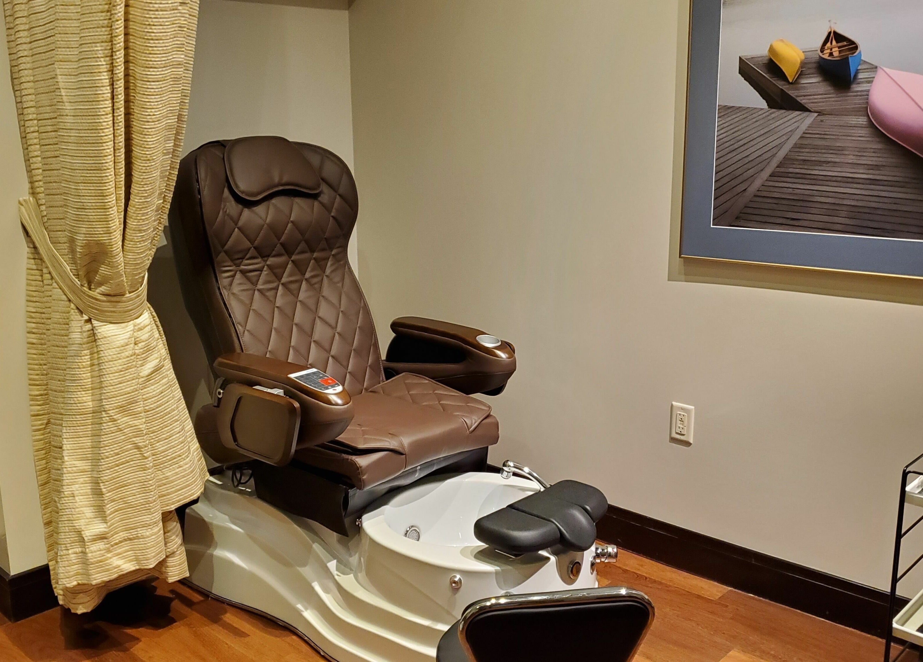 Luxury pedicure chair at Five Lakes Spa Aveda, Niagara Falls, Ontario, CA, offering ultimate relaxation.