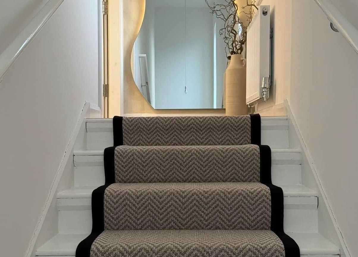 Stylish staircase at The Booth in Shafton, England, GB, featuring elegant decor and calming ambiance.