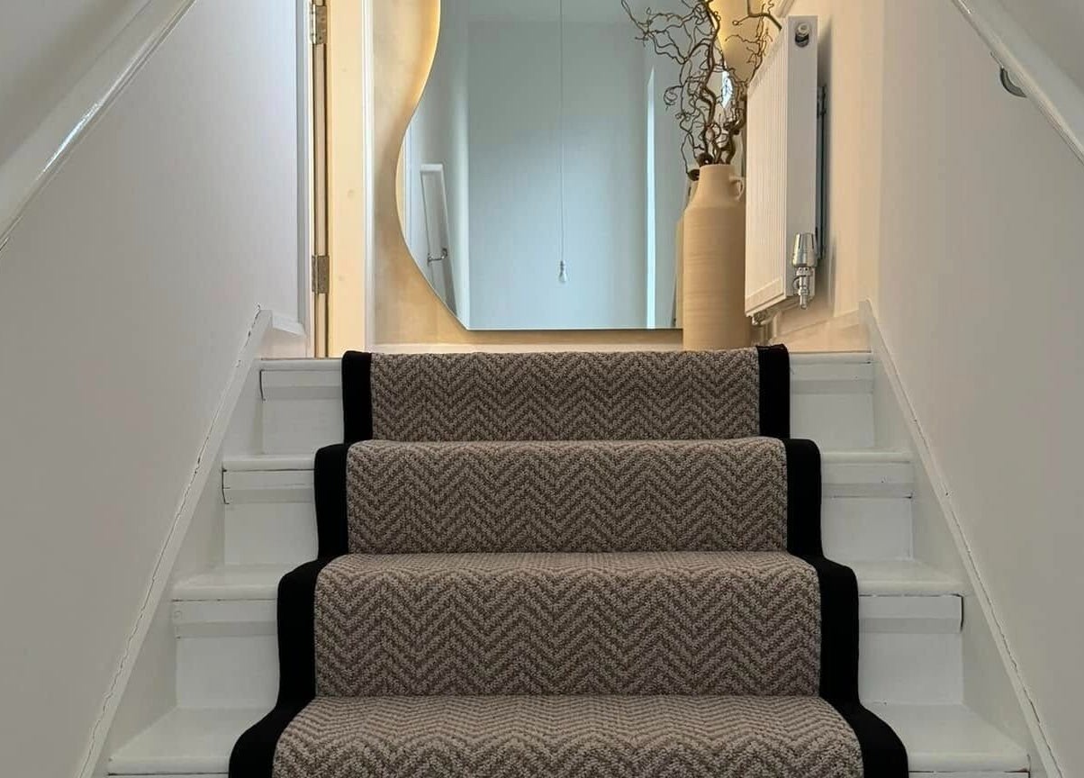 Stylish staircase at The Booth in Shafton, England, GB, featuring elegant decor and calming ambiance.