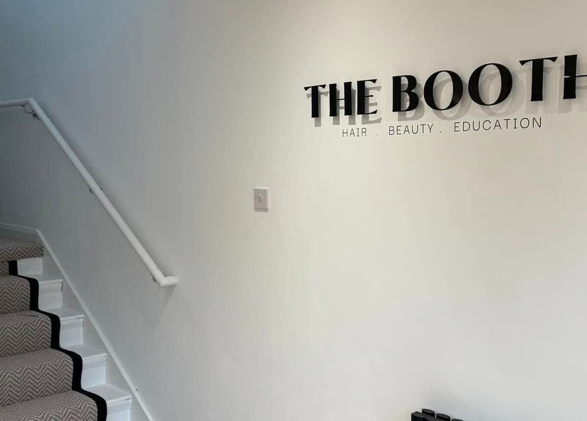 The Booth entrance hallway in Shafton, England, GB with stairs and signage on the wall.