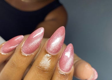 Pink shimmering nails at Atinas’ Nail Studio, Oistins, Christ Church, BB. Discover exquisite nail art here.
