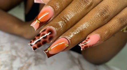 Intricate nail art at Atinas' Nail Studio in Oistins, Christ Church, BB, showcasing exquisite design.