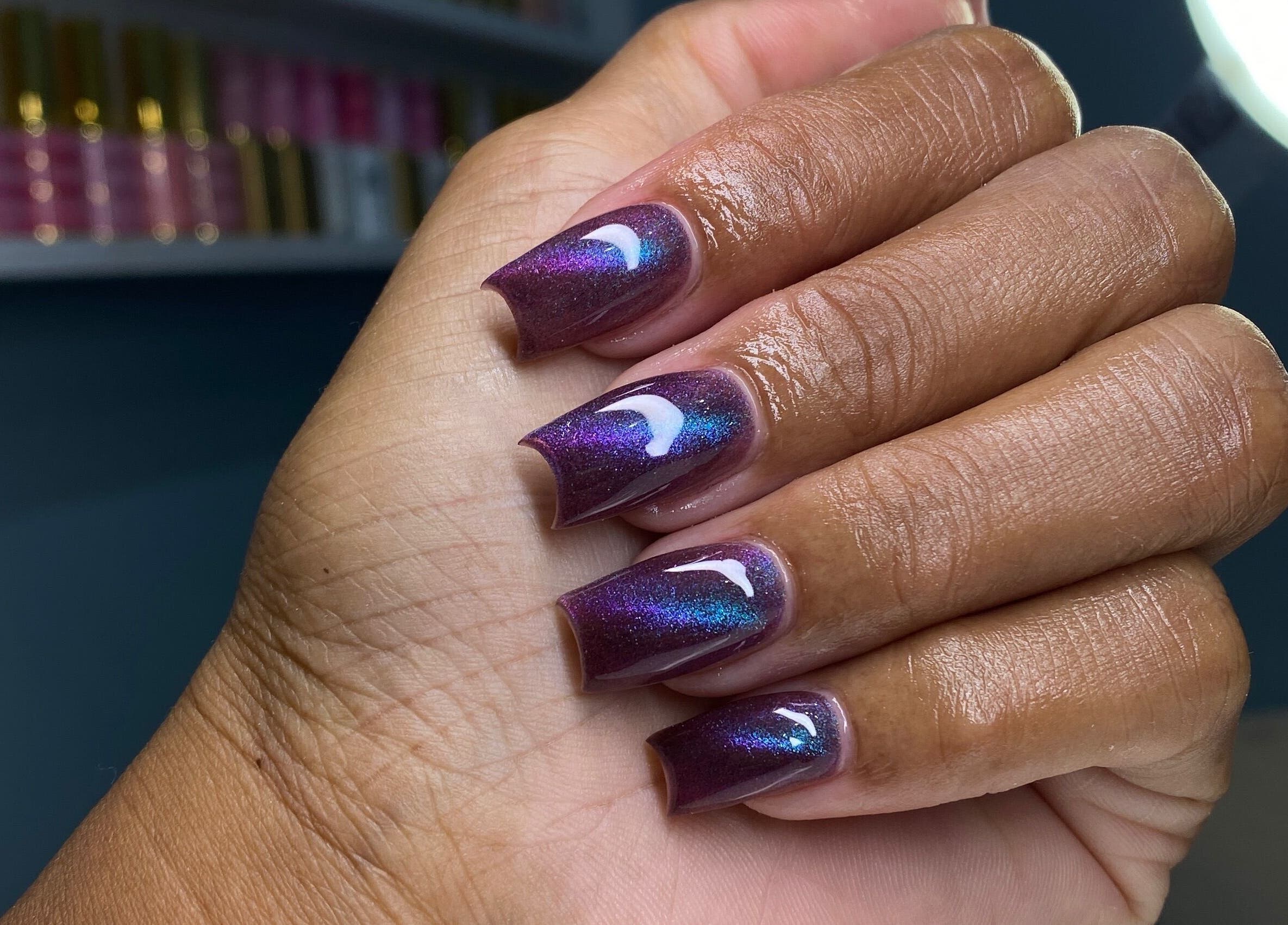 Beautiful iridescent nails from Atinas’ Nail Studio in Oistins, Christ Church, BB, showcasing expert design.