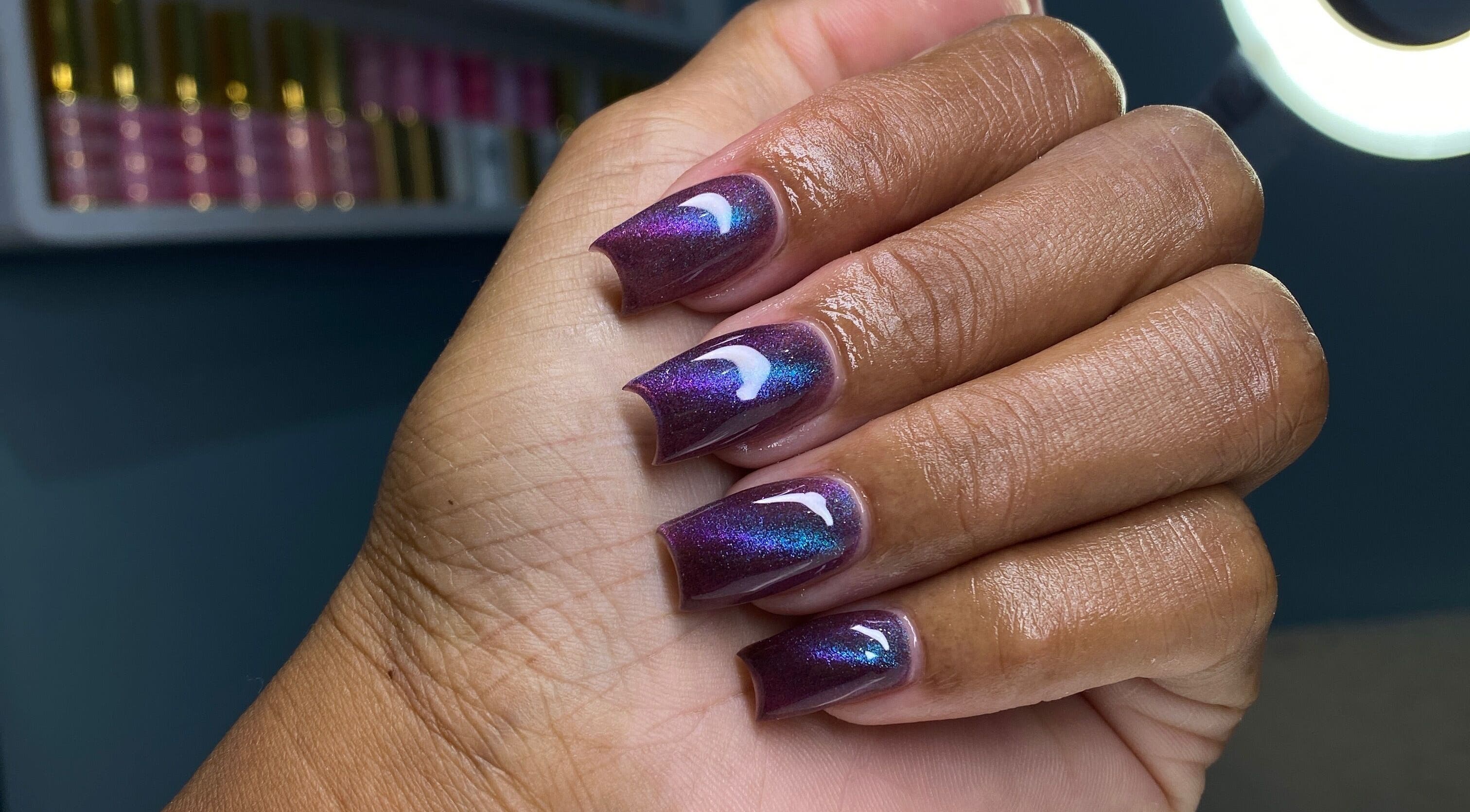 Beautiful iridescent nails from Atinas’ Nail Studio in Oistins, Christ Church, BB, showcasing expert design.