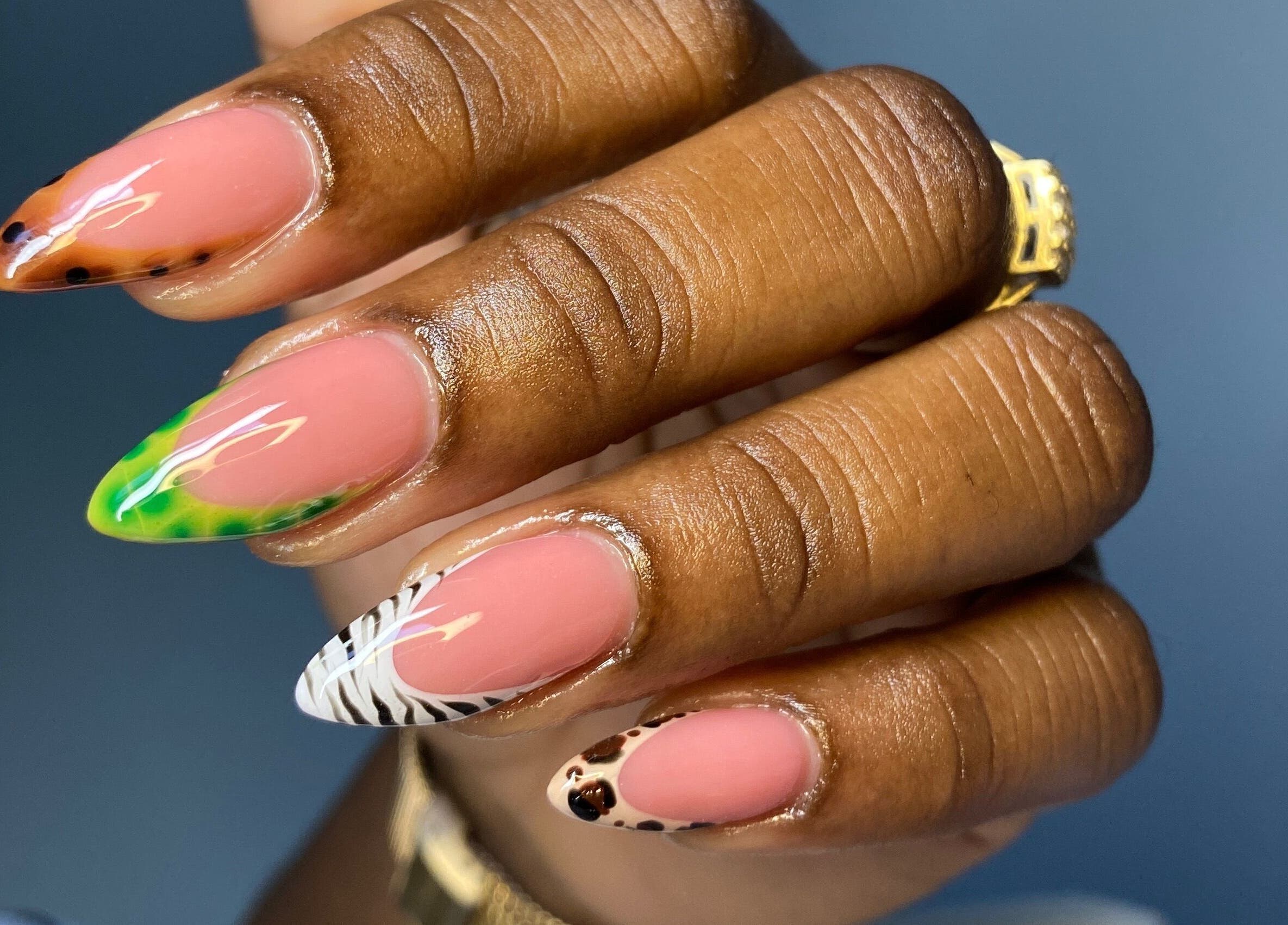 Vibrant nail art at Atinas’ Nail Studio, Oistins, Christ Church, BB. Beautiful and unique designs displayed.