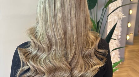 Blonde hair in soft waves at SLJ HAIR & HAIR EXTENSION SPECIALIST, Stockton-on-Tees, England, GB.