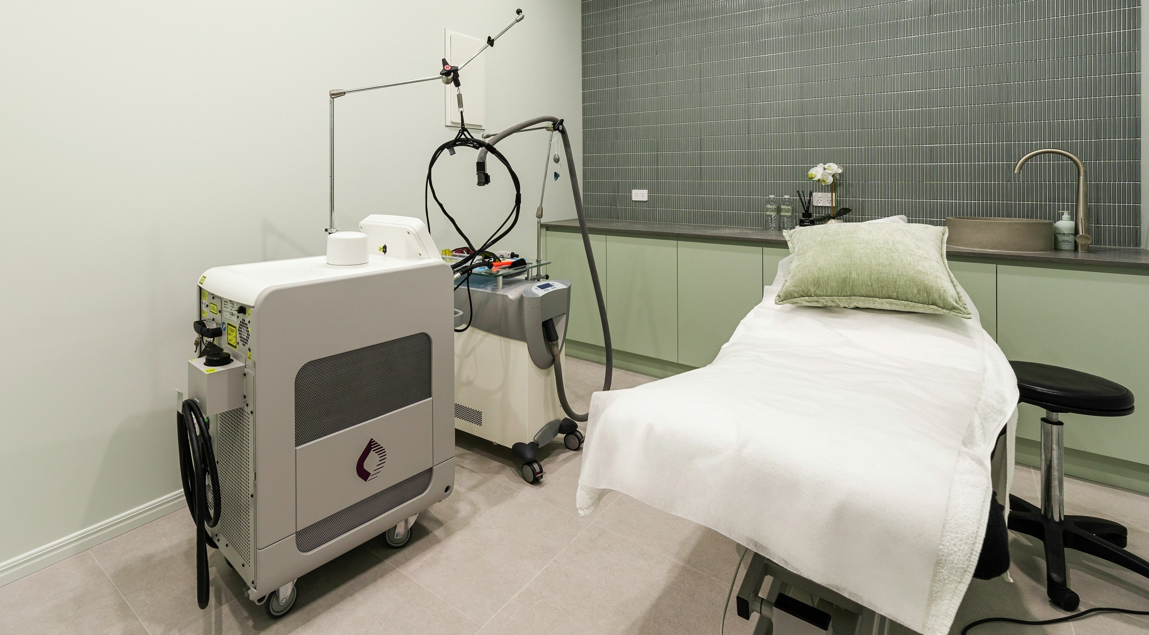 Modern treatment room at IINSKIN, Biggera Waters, Queensland, AU, featuring advanced skincare equipment.